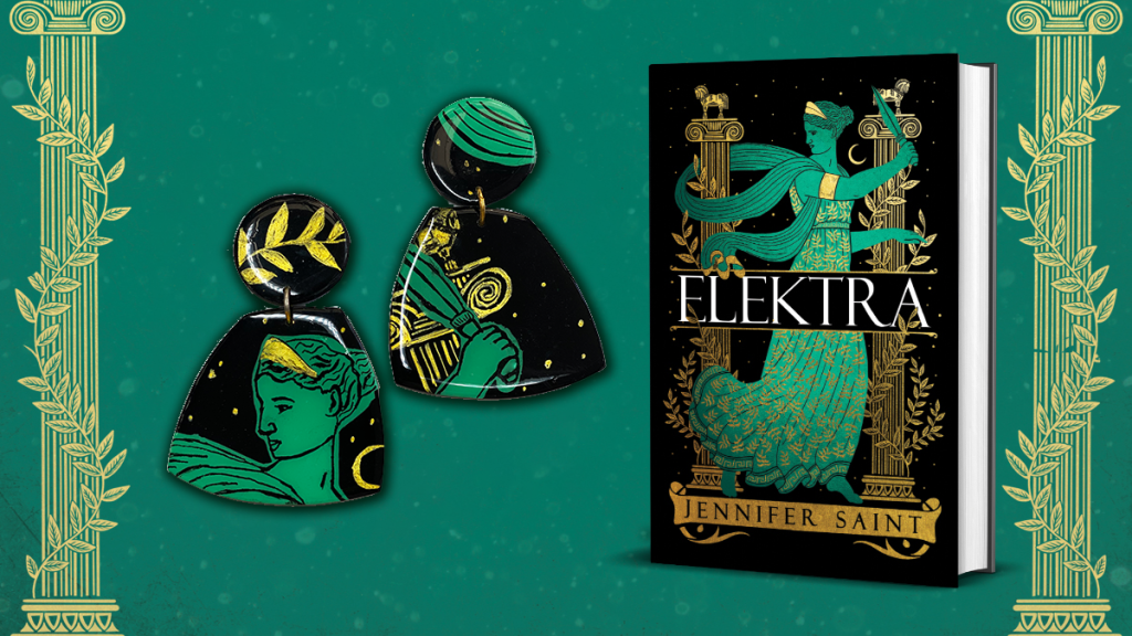 A pair of Studio Eris earrings designed to look like the cover of Jennifer Saint's book Elektra